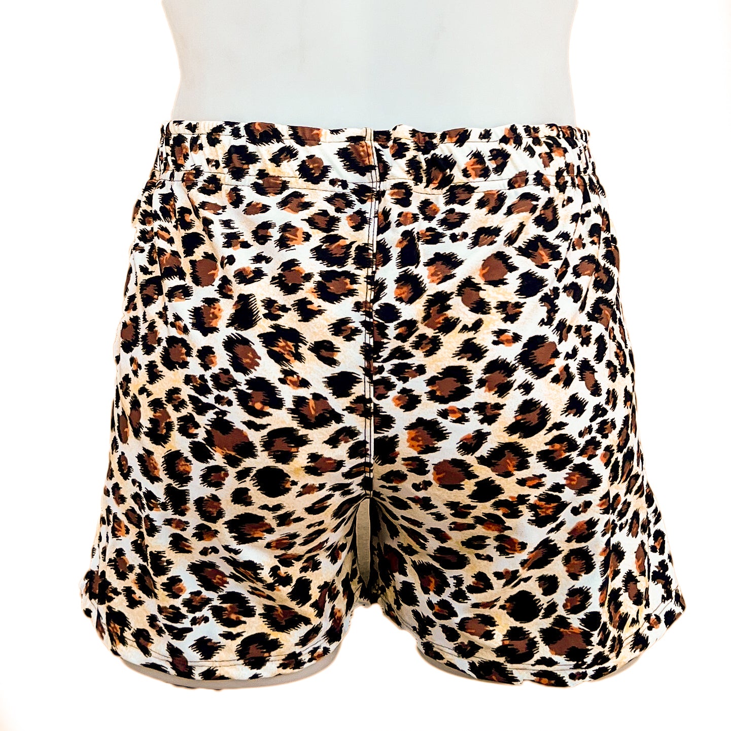 Leopard Swim shorts on a white mannequin.