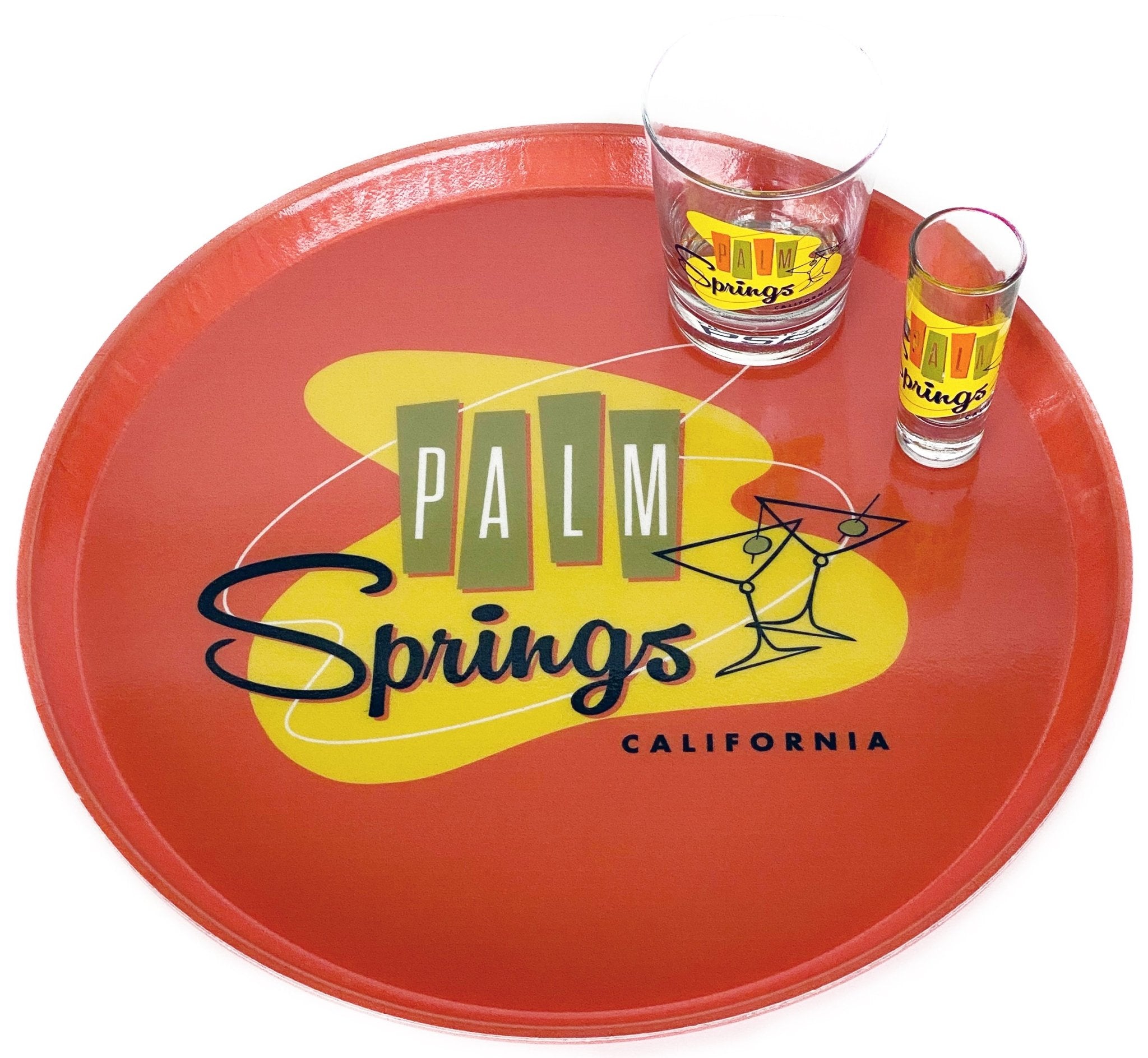 round orange tray with retro design that says Palm Springs California and shows two martini glasses with olives