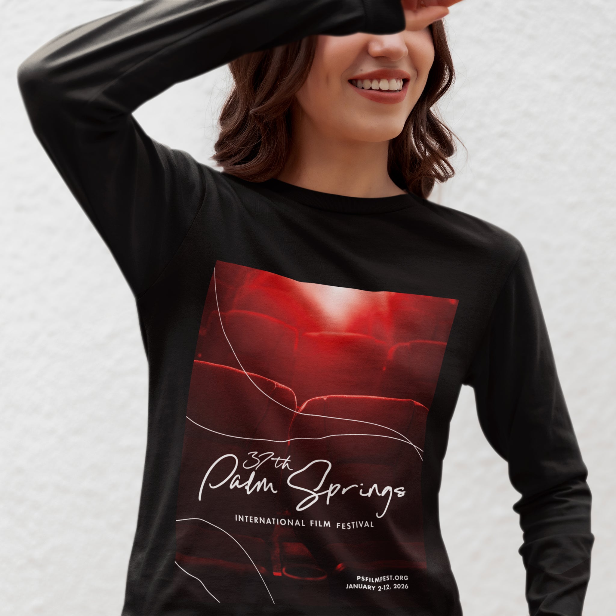 Person wearing a black long-sleeve shirt with a red and white graphic design on a light gray background