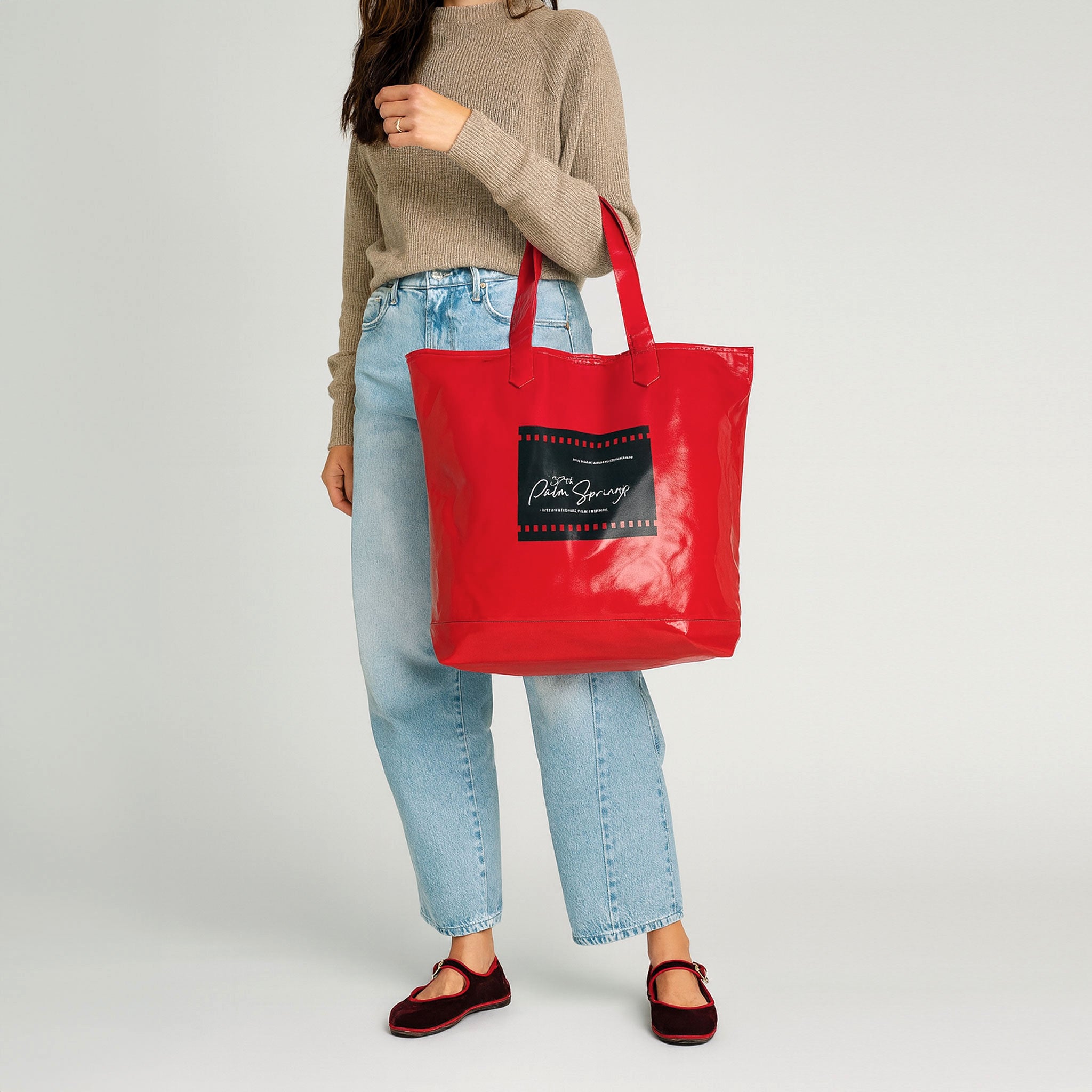 2026-palm-springs-film-festival-poster-tote-bag-red_model_lifestyle_01_b721720f-e6ee-4d0d-afd4-7a97e68bf495.jpg