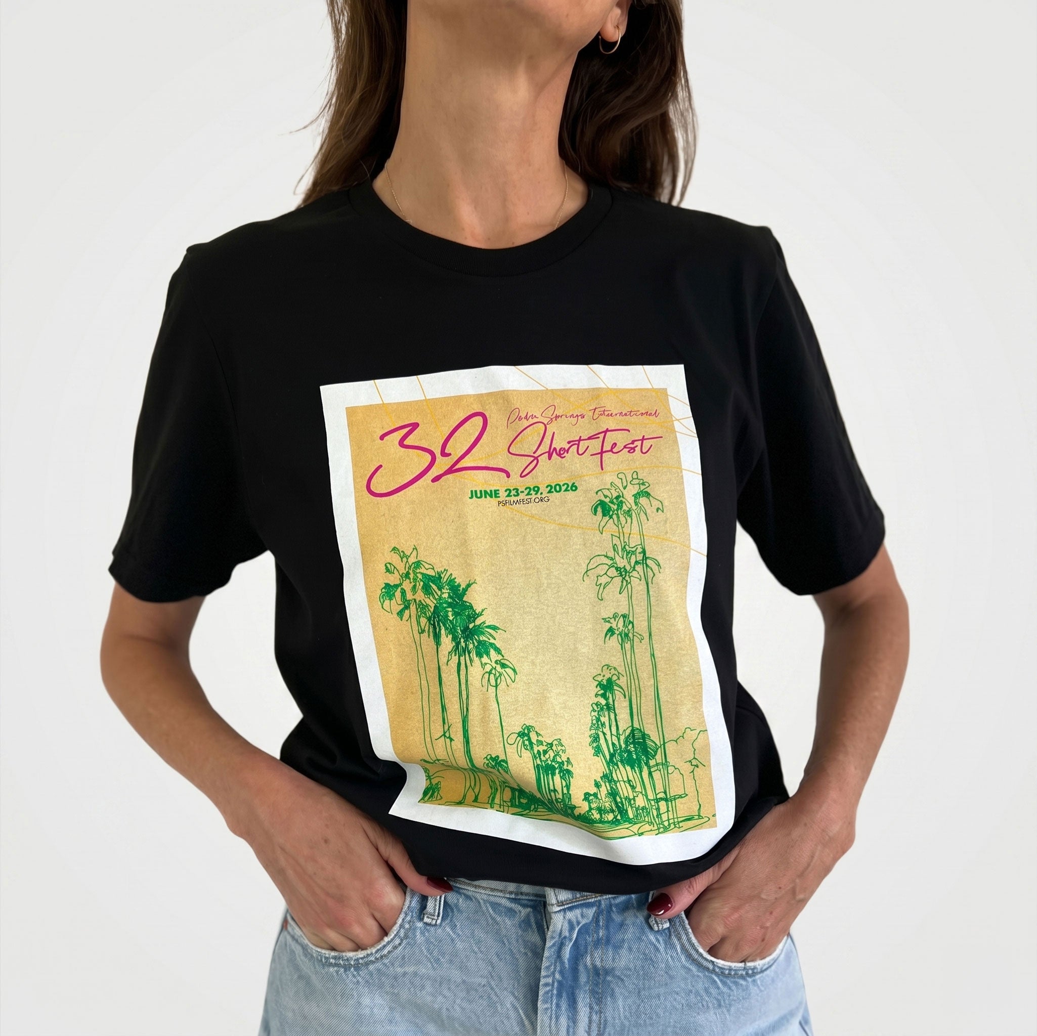 Person wearing a black t-shirt with a graphic design on a white background