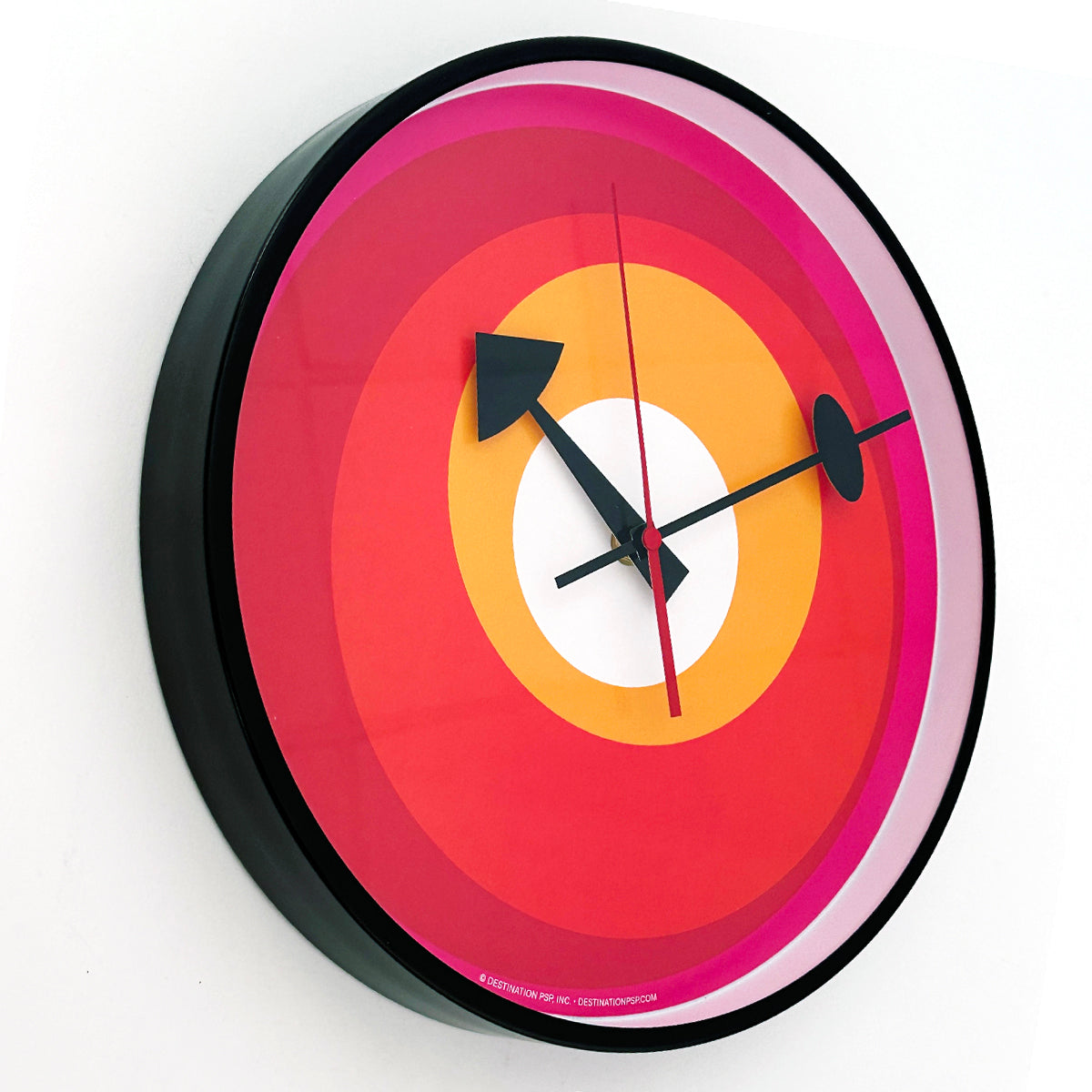 mod wall clock with no numbers but just red, yellow, pink and white circles