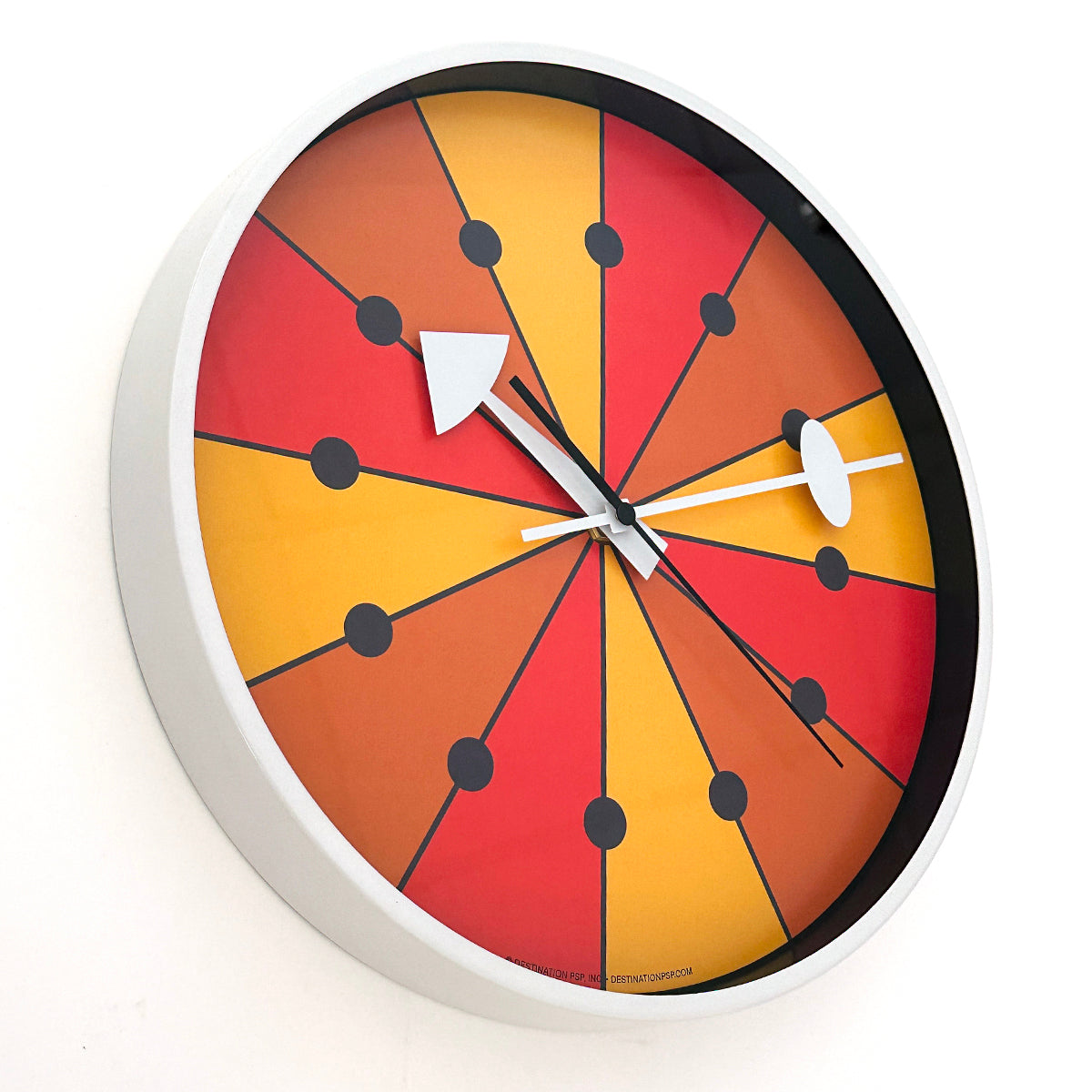 mod orange yellow and red wall clock with white hands and rim