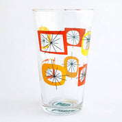 Clear glass with colorful geometric design on a white background