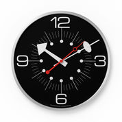 Wall clock with black face, silver rim, and red second hand on a white background