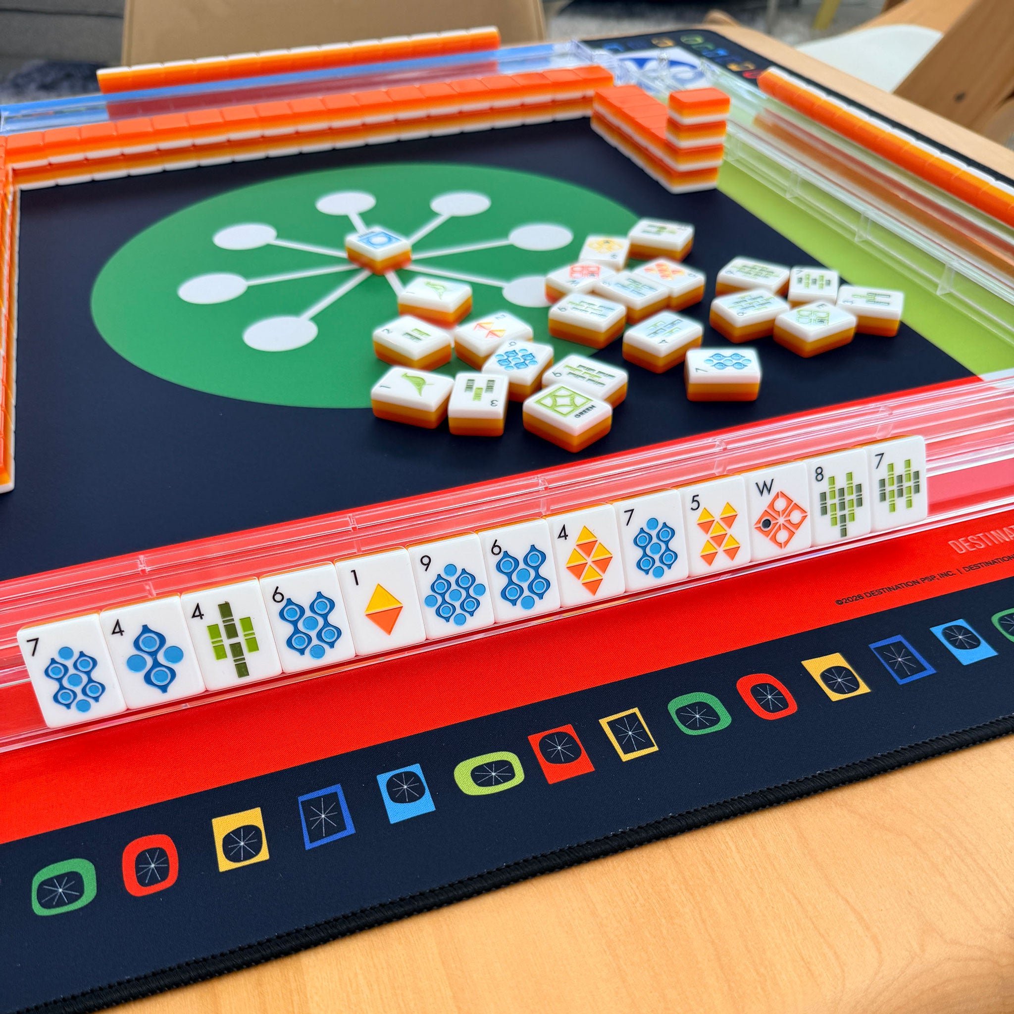 Mahjong game set on a wooden table