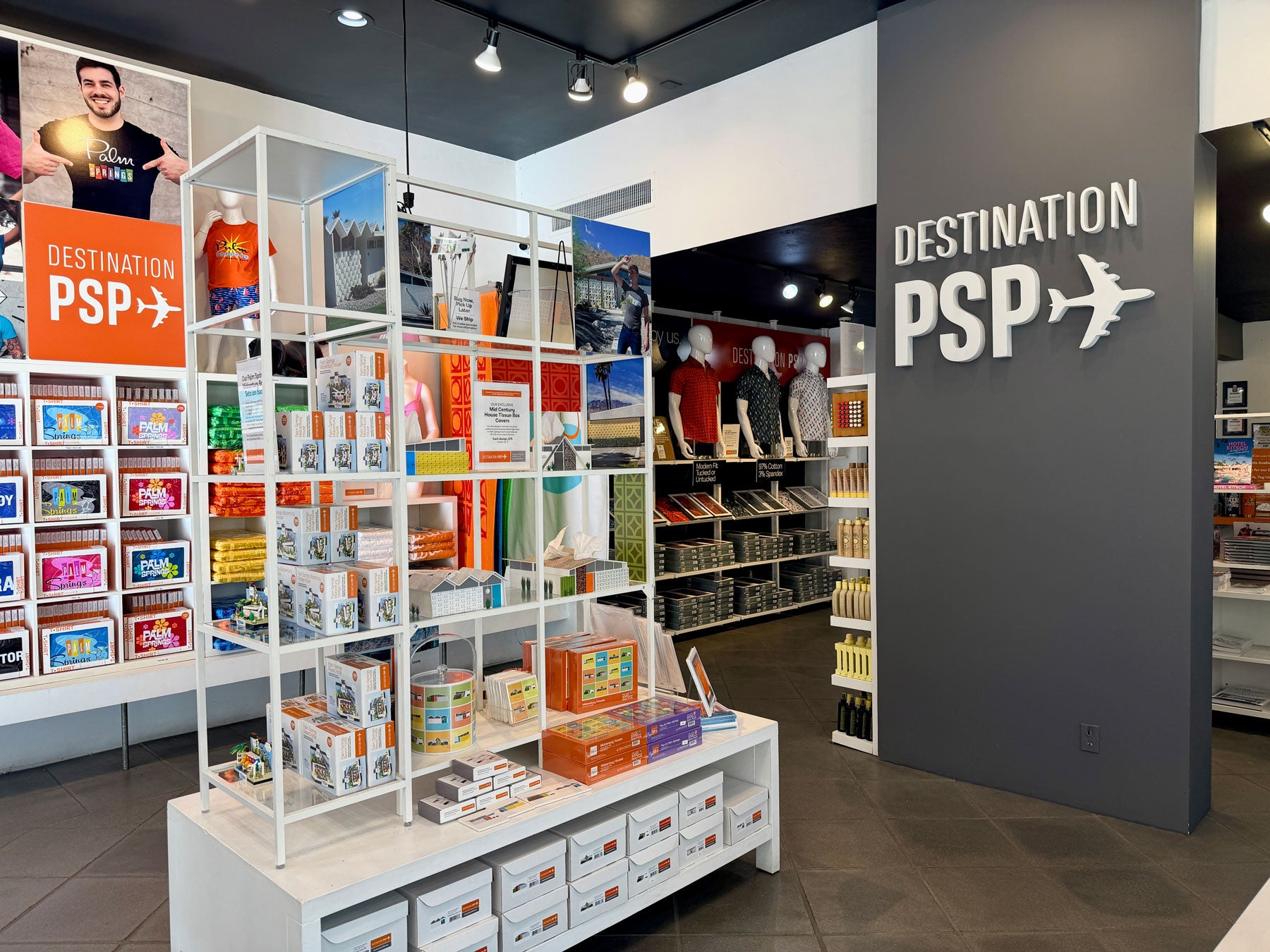 Store interior with shelves displaying products and a 'Destination PSP' sign on the wall.