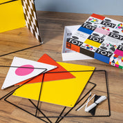Colorful geometric shapes and packaging on a wooden surface
