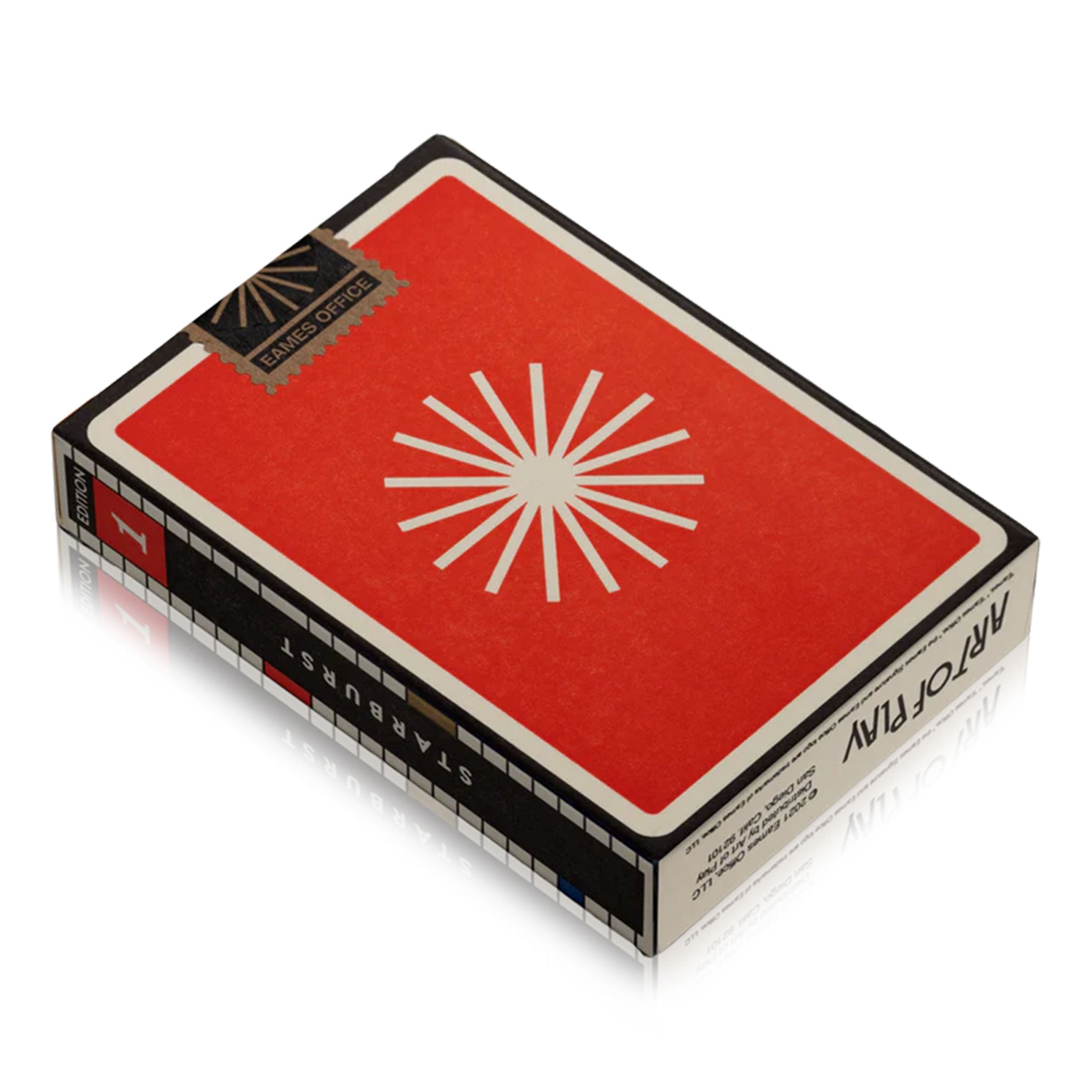 Red playing card box with white star design on a white background