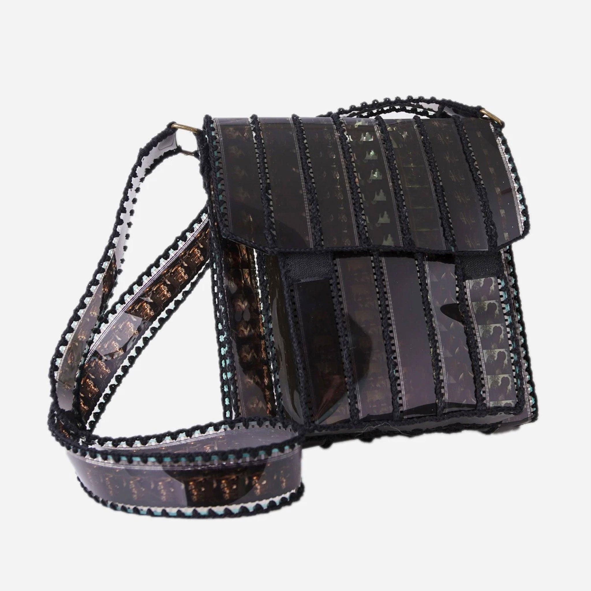 Black film strip handbag on a white background