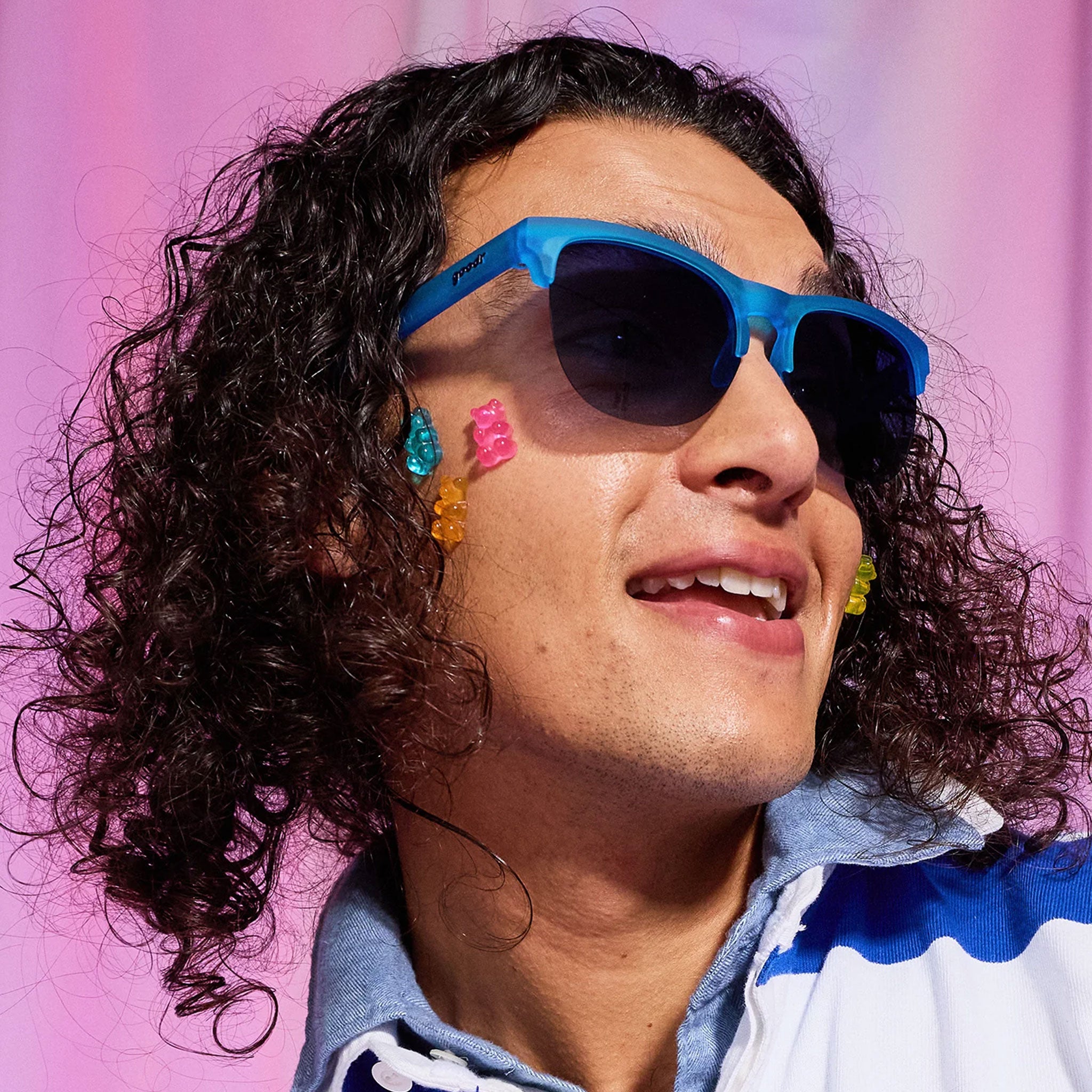 A man wearing blue sunglasses