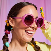 a woman wearing pink sunglasses
