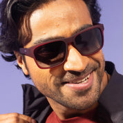 Man wearing sunglasses with a blurred background