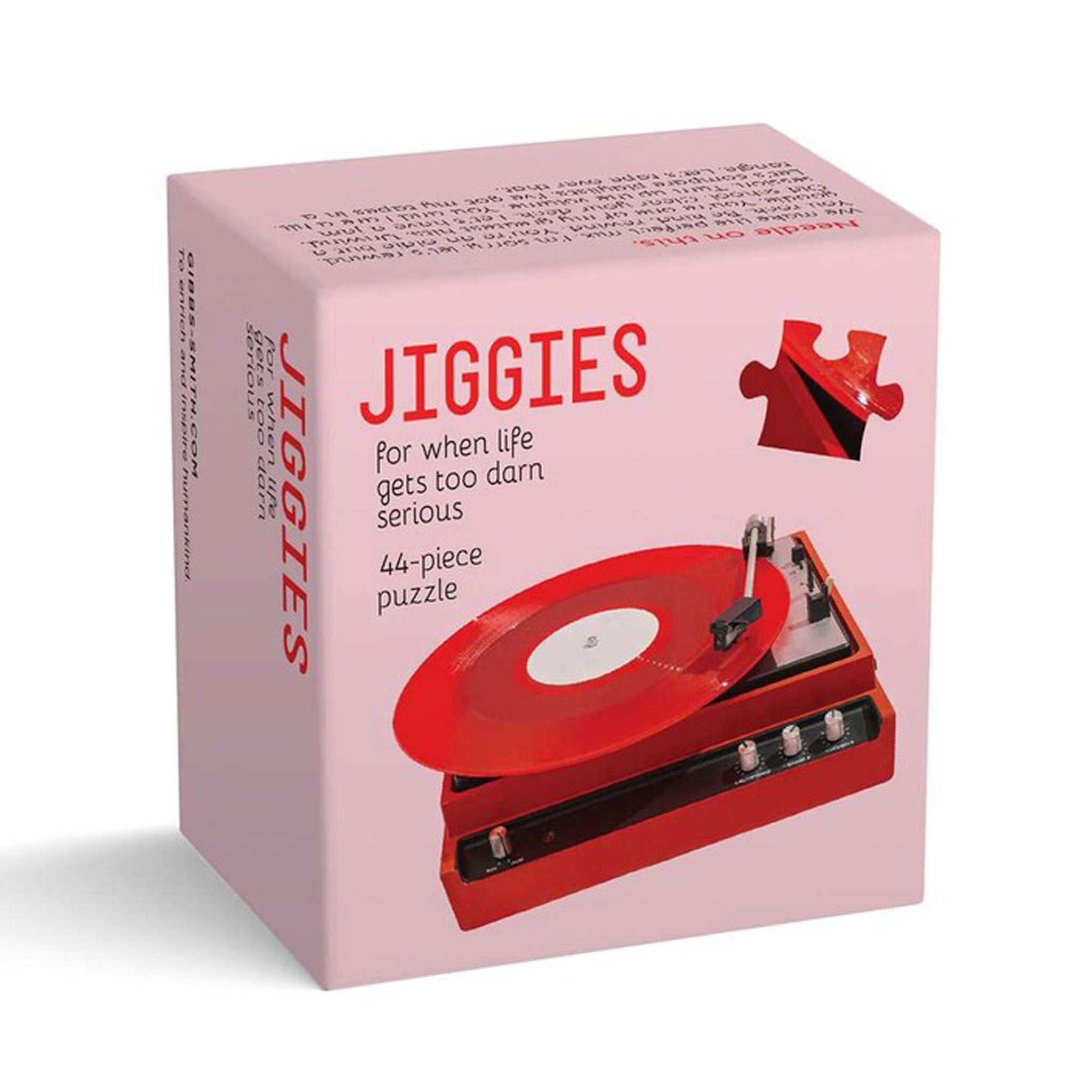 Box of 'Jiggies' puzzle with red record player design on pink background