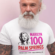 Man wearing a white t-shirt with Marilyn Monroe graphic and text about Palm Springs event.