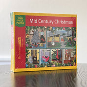 Jigsaw puzzle box titled 'Mid Century Christmas' with colorful illustrations on a white background
