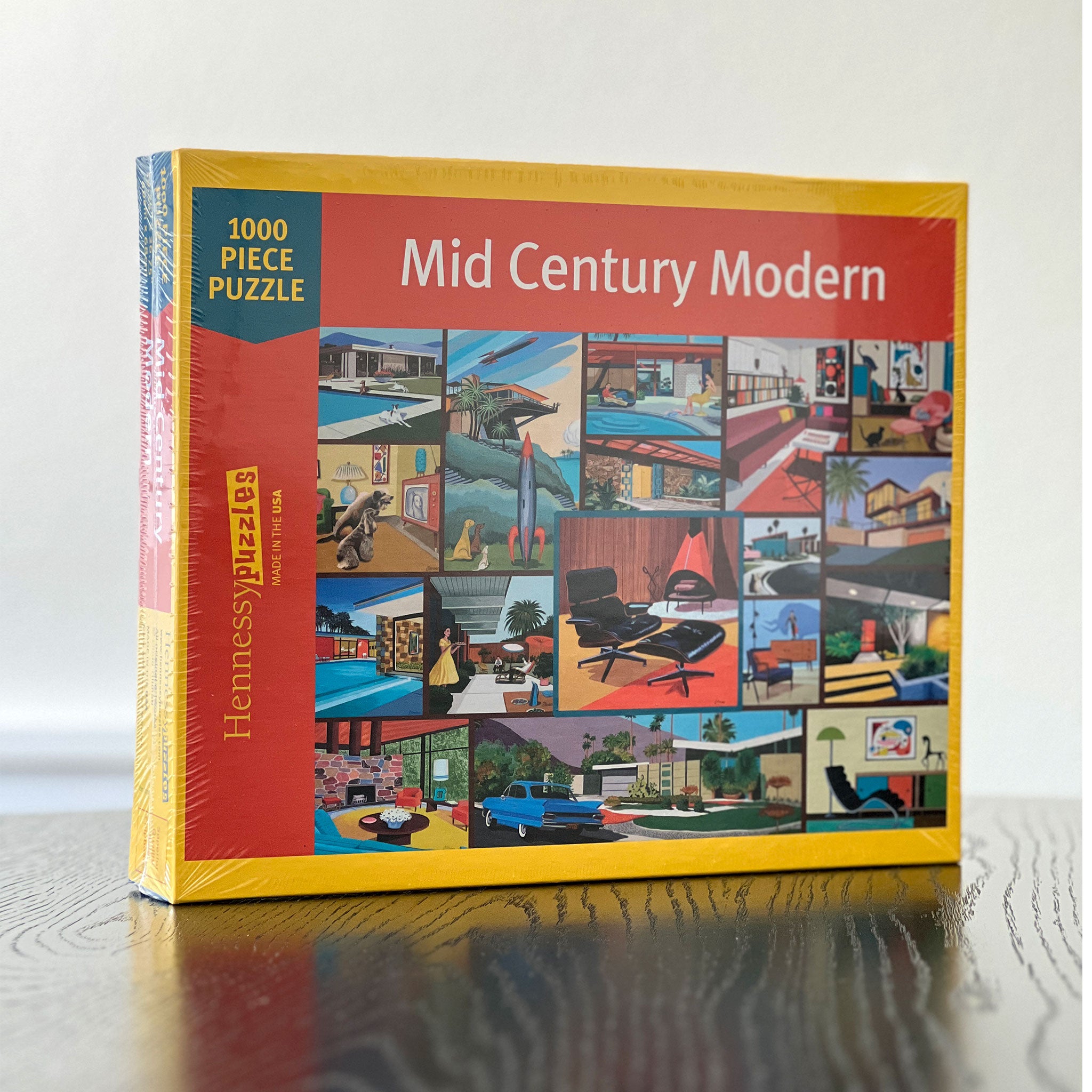 Jigsaw puzzle box titled 'Mid Century Modern' with colorful illustrations on a white background
