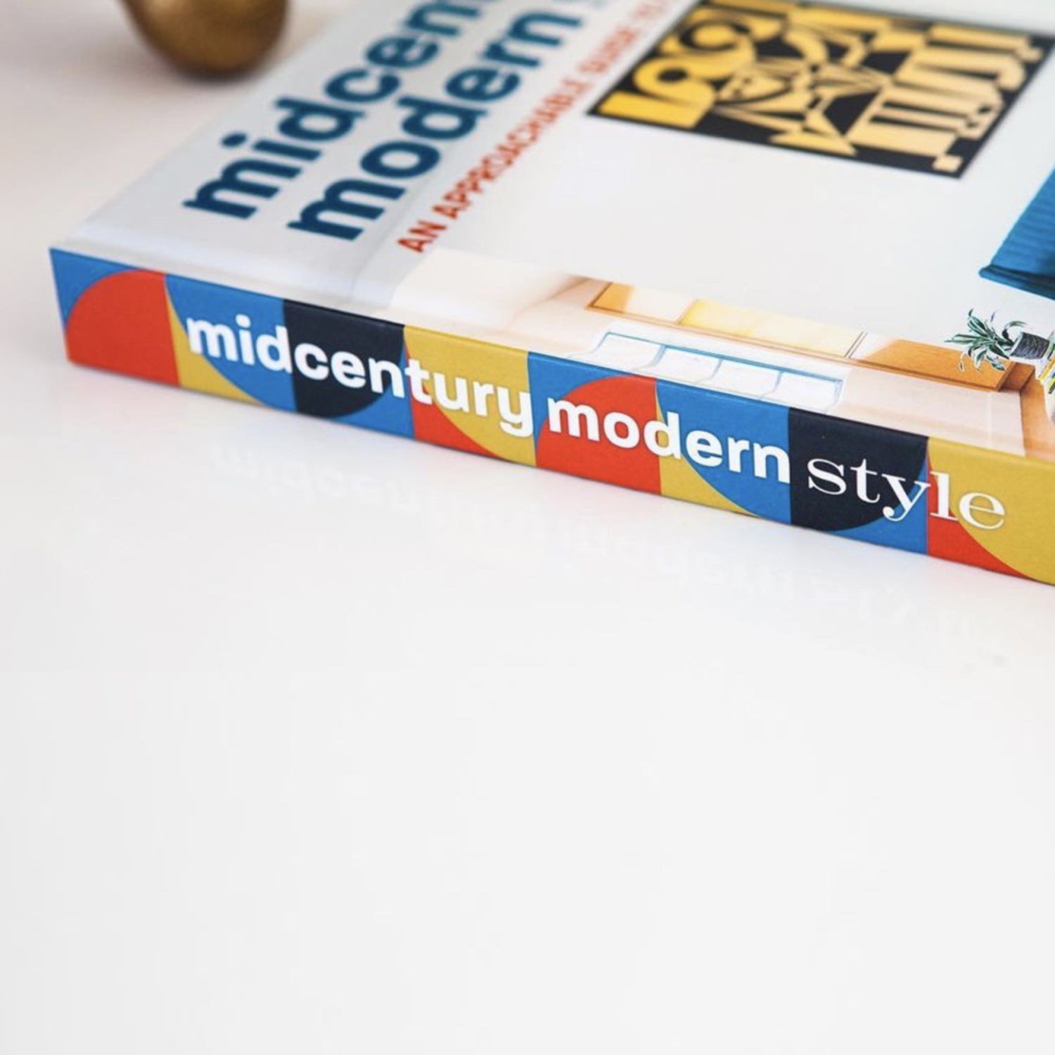 Midcentury Modern Style book on a white table.