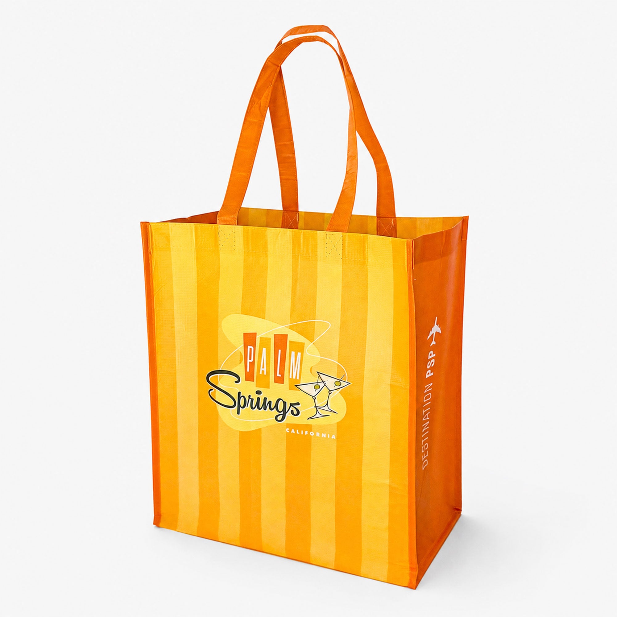 Orange and yellow striped tote bag with 'Palm Springs' branding on a white background