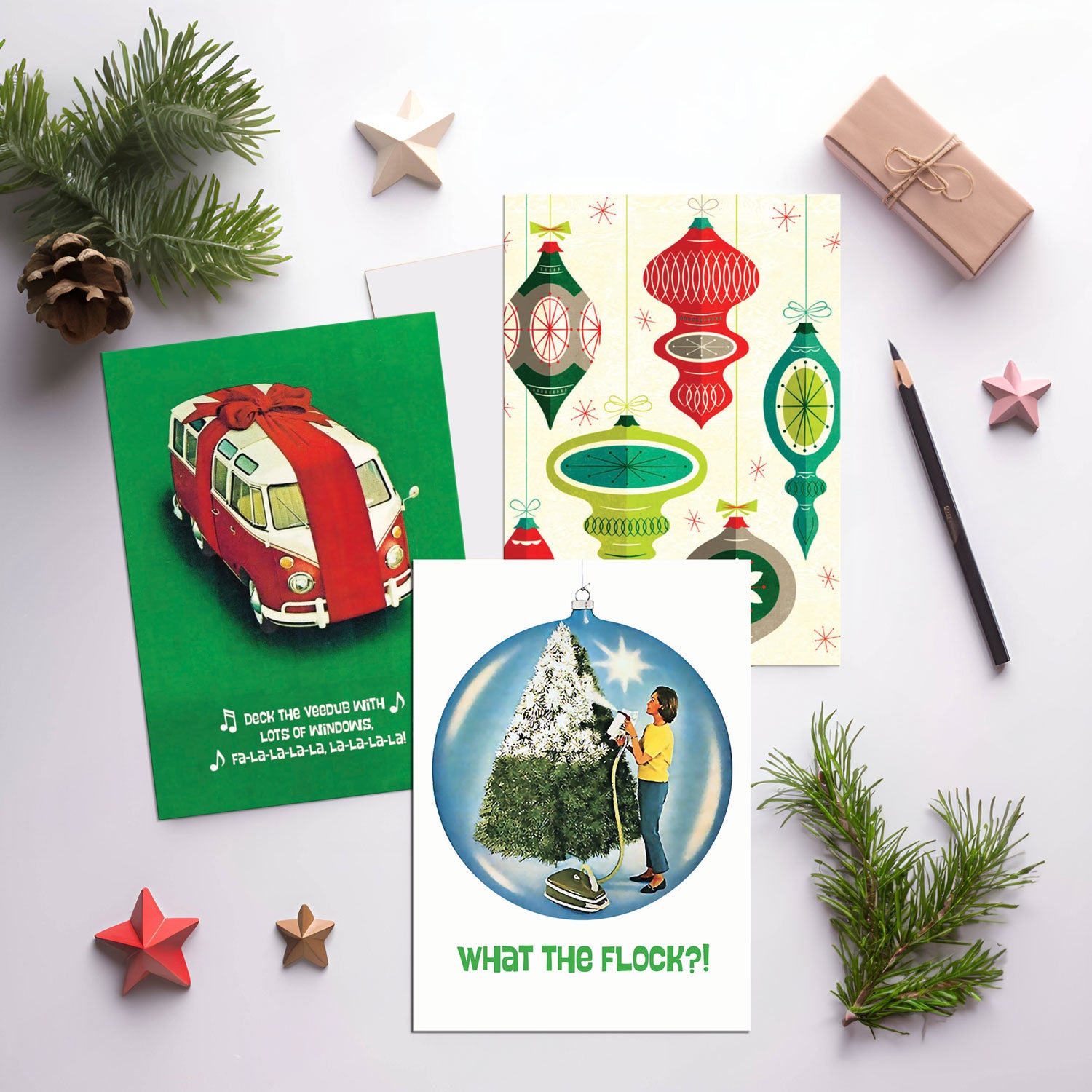 Collection of Christmas-themed cards on a white surface with decorative elements.